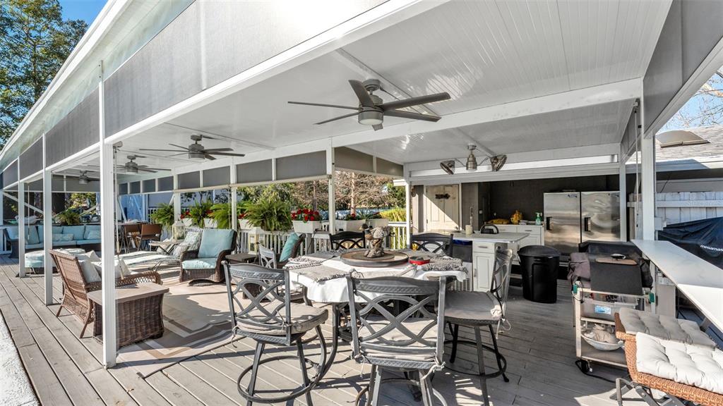 3830 Clubhouse Road Lakeland, FL 33812 - Photo 29 of 42 a view of a patio with dining table and chairs