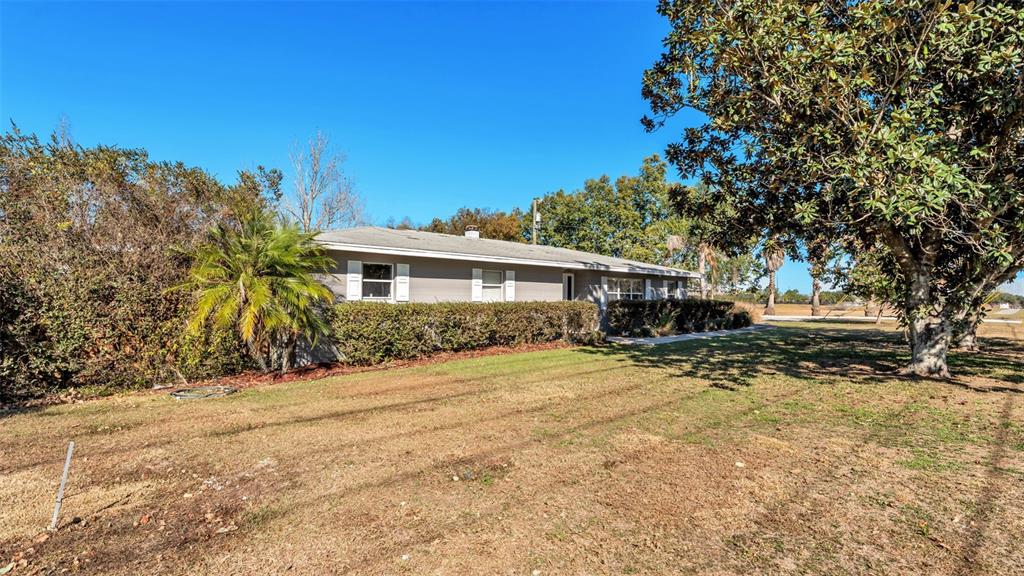3830 Clubhouse Road Lakeland, FL 33812 - Photo 3 of 42 a view of a house with a tree in the background