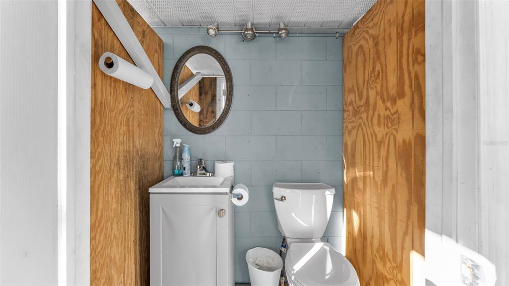 3830 Clubhouse Road Lakeland, FL 33812 - Photo 31 of 42 a bathroom with a toilet and a sink