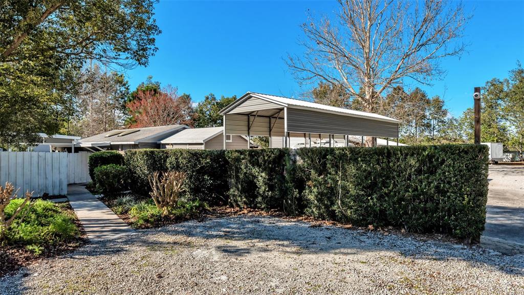 3830 Clubhouse Road Lakeland, FL 33812 - Photo 35 of 42 a front view of a house with garden