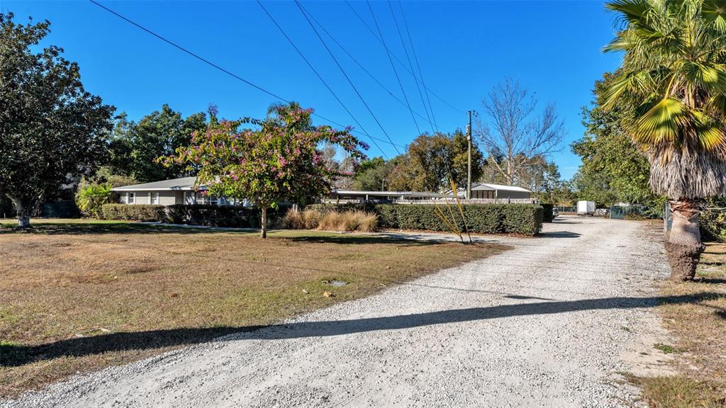 3830 Clubhouse Road Lakeland, FL 33812 - Photo 4 of 42 a view of a street with houses