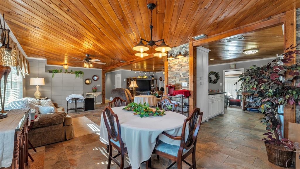 3830 Clubhouse Road Lakeland, FL 33812 - Photo 9 of 42 a view of a dining room with furniture and a chandelier
