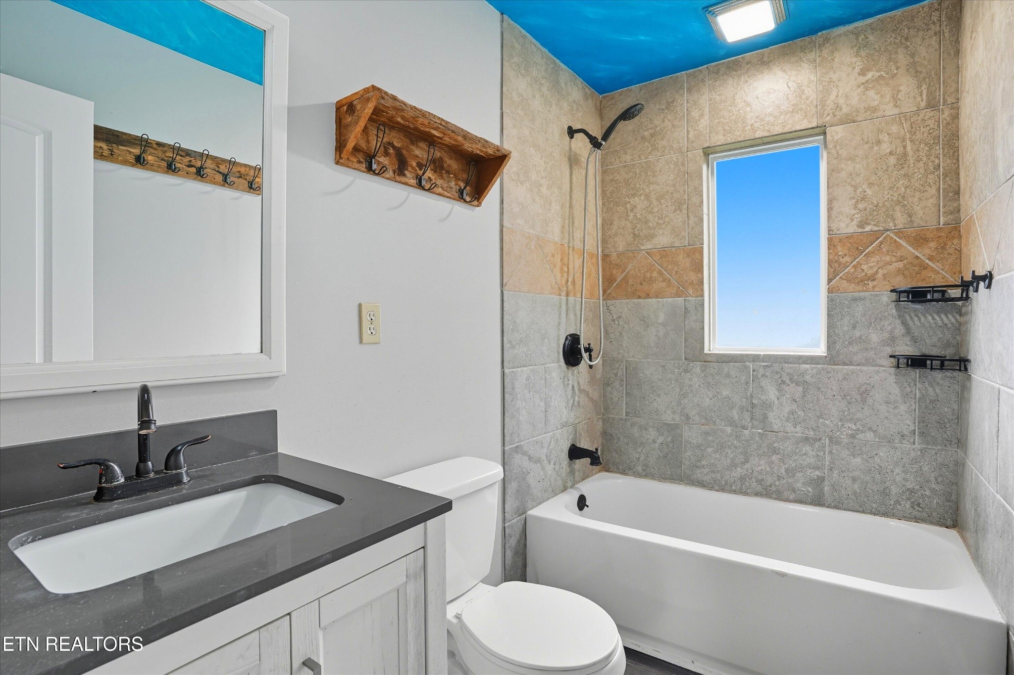 100102 Howard Lane Oak Ridge, TN 37830 - Photo 12 of 25 a bathroom with a granite countertop sink toilet and shower