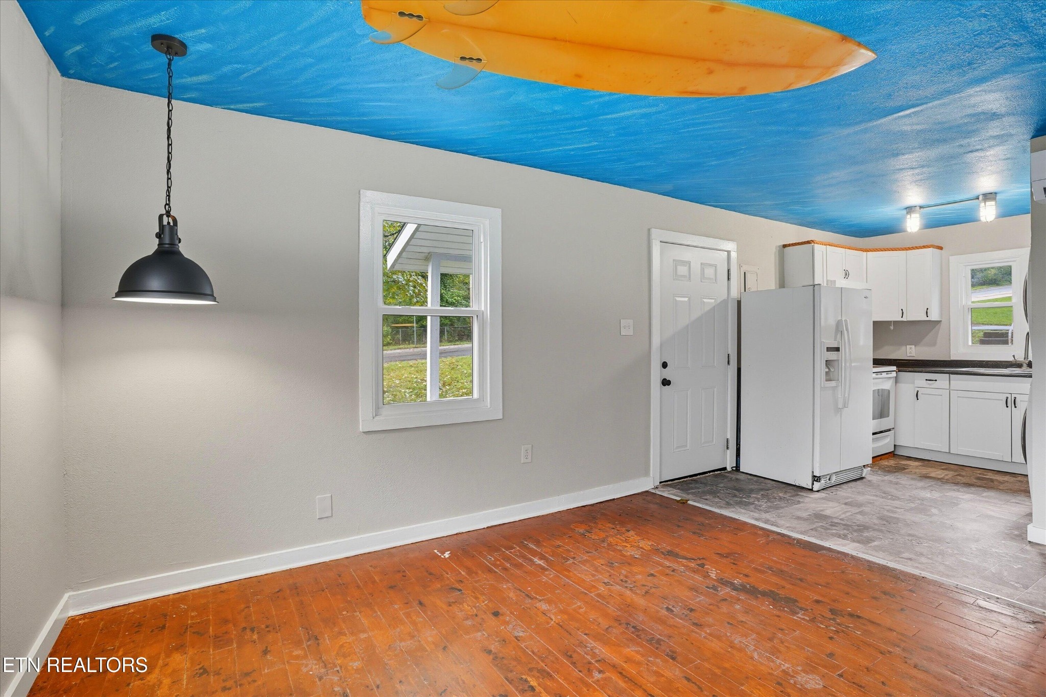 100102 Howard Lane Oak Ridge, TN 37830 - Photo 4 of 25 a view of an empty room with window and wooden floor