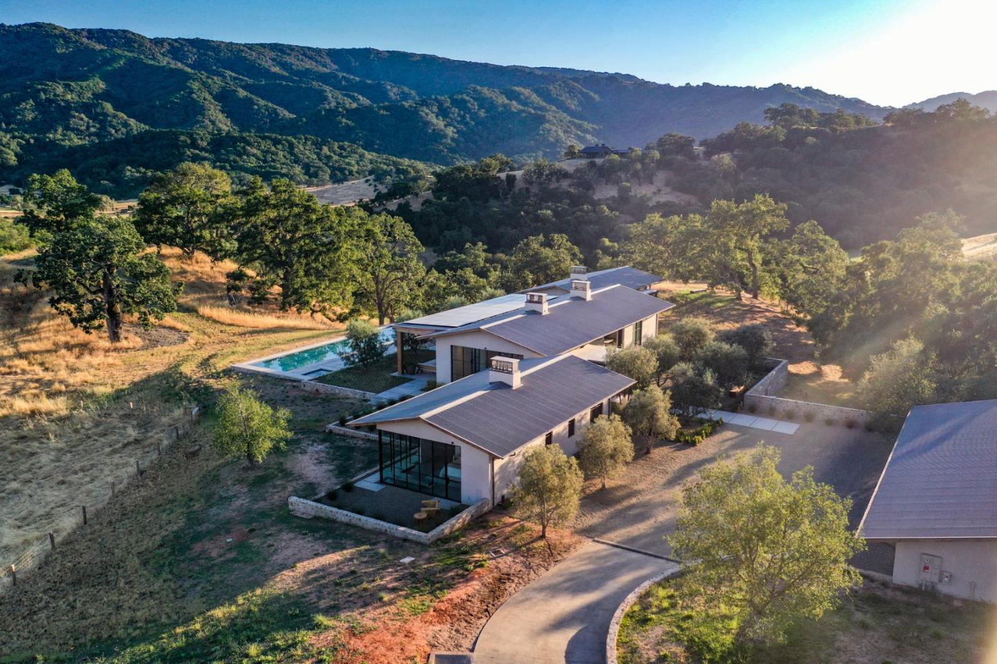an aerial view of a house with mountain view