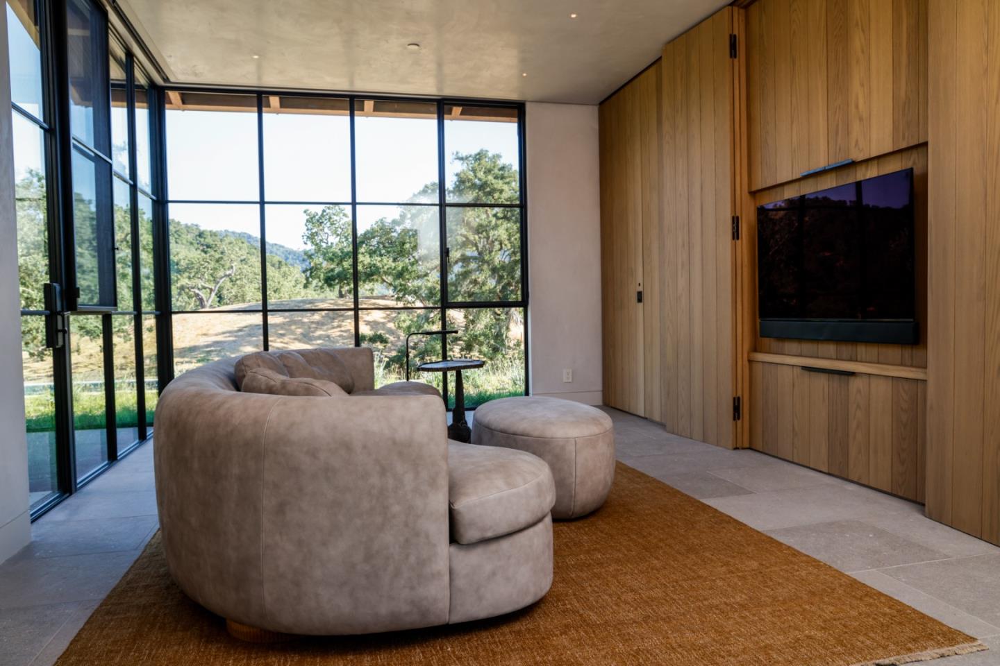 16 Touche Pass Carmel, CA 93923 - Photo 19 of 42 a living room with a bed furniture and a large window