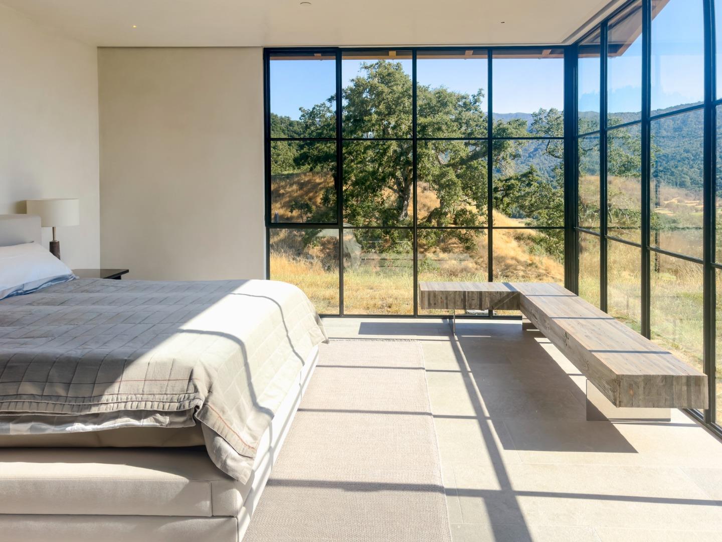 16 Touche Pass Carmel, CA 93923 - Photo 22 of 42 a living room with a large window and a table