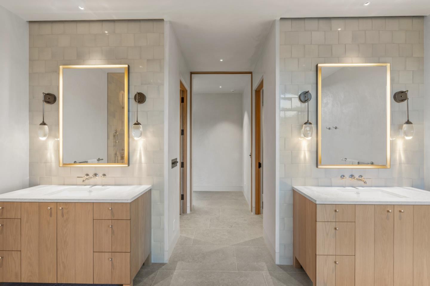 16 Touche Pass Carmel, CA 93923 - Photo 23 of 42 a bathroom with a sink a mirror a vanity and a shower