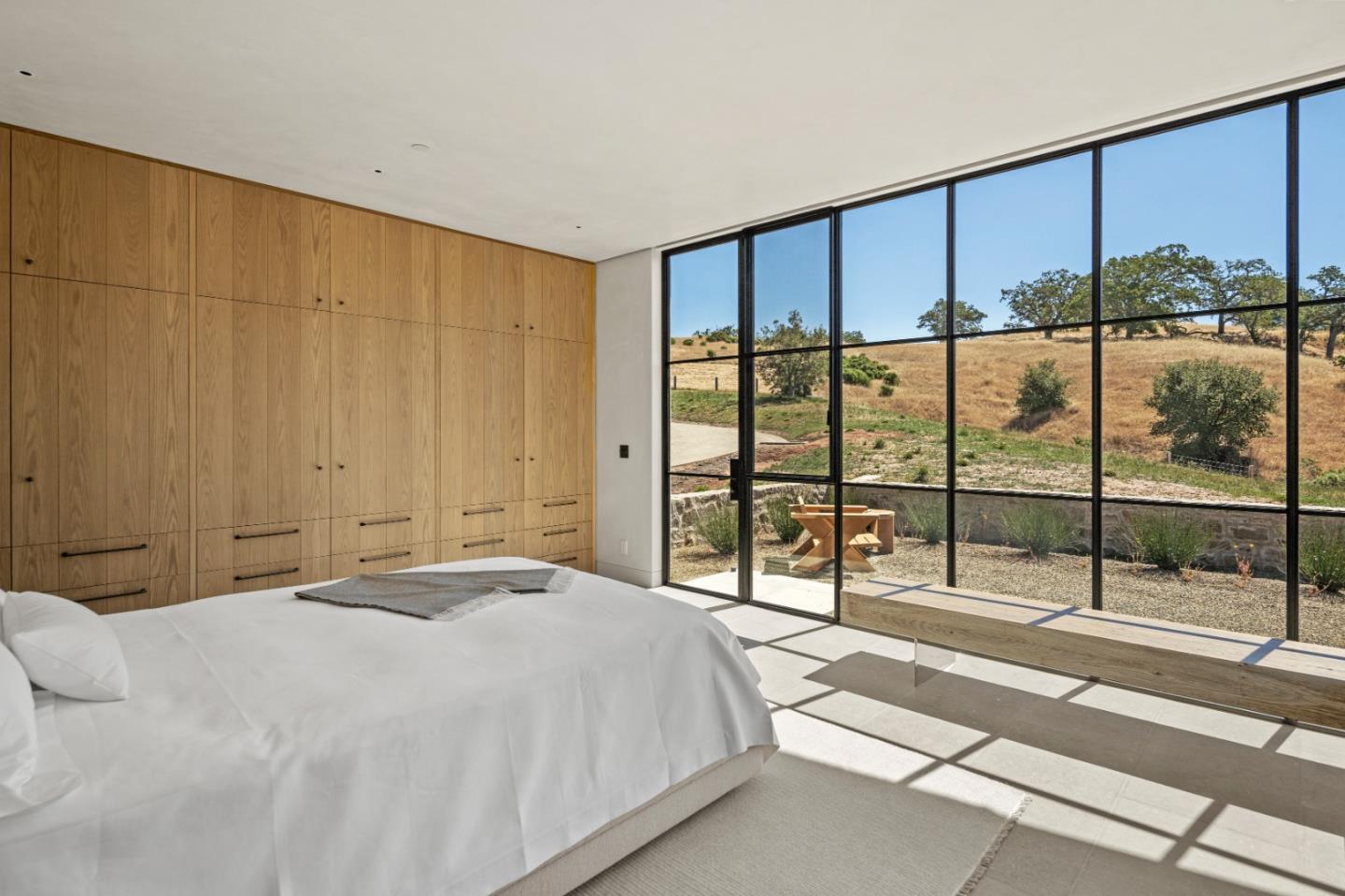 16 Touche Pass Carmel, CA 93923 - Photo 25 of 42 a bedroom with a large window and walk in closet