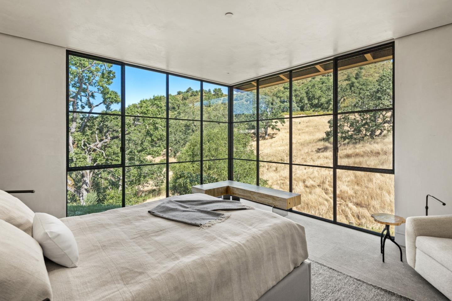 16 Touche Pass Carmel, CA 93923 - Photo 33 of 42 a bedroom with a large window and a bed