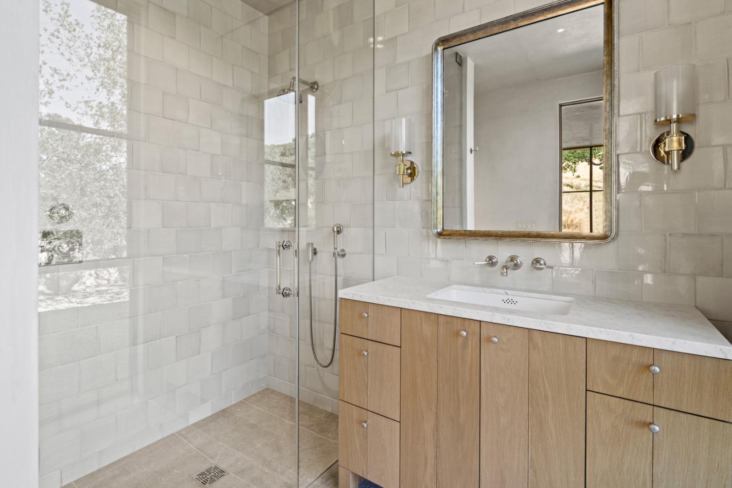 16 Touche Pass Carmel, CA 93923 - Photo 34 of 42 a bathroom with a sink and a mirror