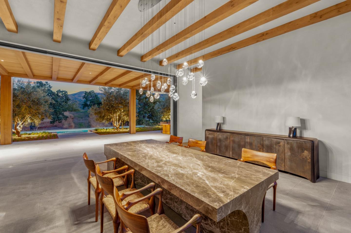 16 Touche Pass Carmel, CA 93923 - Photo 9 of 42 a view of a swimming pool with a table and chairs in the patio