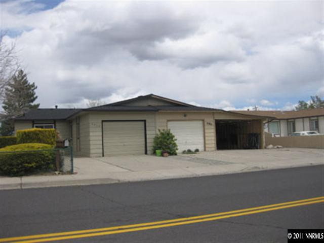 6905 Lotus Street Reno, NV 89506 - Photo 1 of 9 a view of a house with a cars park on road