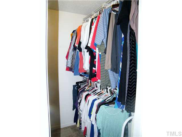 4925 Mocha Lane Raleigh, NC 27616 - Photo 15 of 25 a view of walk in closet with clothes