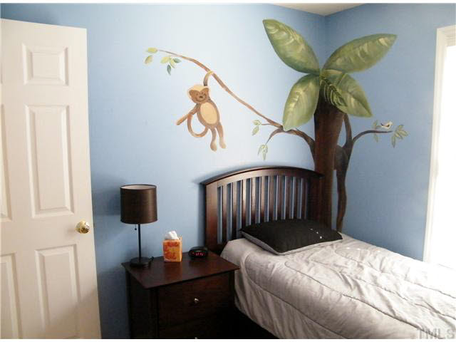 4925 Mocha Lane Raleigh, NC 27616 - Photo 16 of 25 a bedroom with a bed and a window