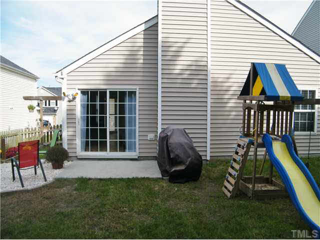 4925 Mocha Lane Raleigh, NC 27616 - Photo 20 of 25 a view of a house with backyard and a chair