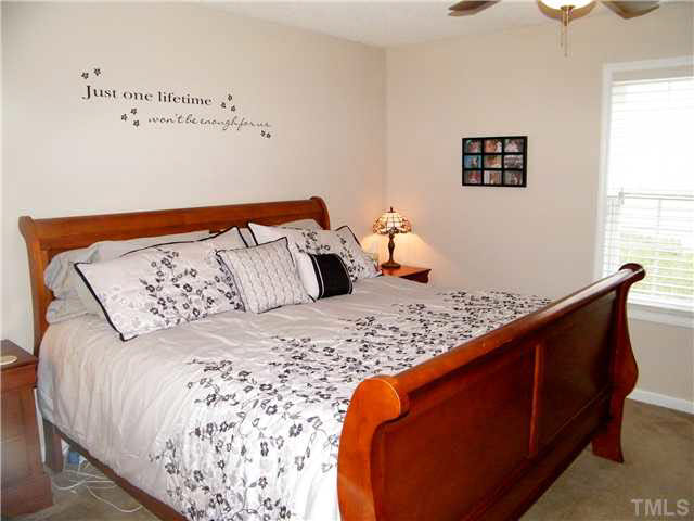 4925 Mocha Lane Raleigh, NC 27616 - Photo 21 of 25 a bedroom with bed and window