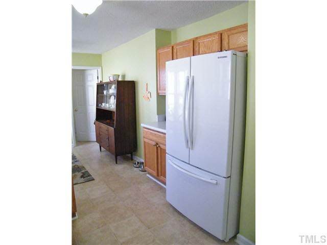 4925 Mocha Lane Raleigh, NC 27616 - Photo 9 of 25 a kitchen with a refrigerator and a refrigerator