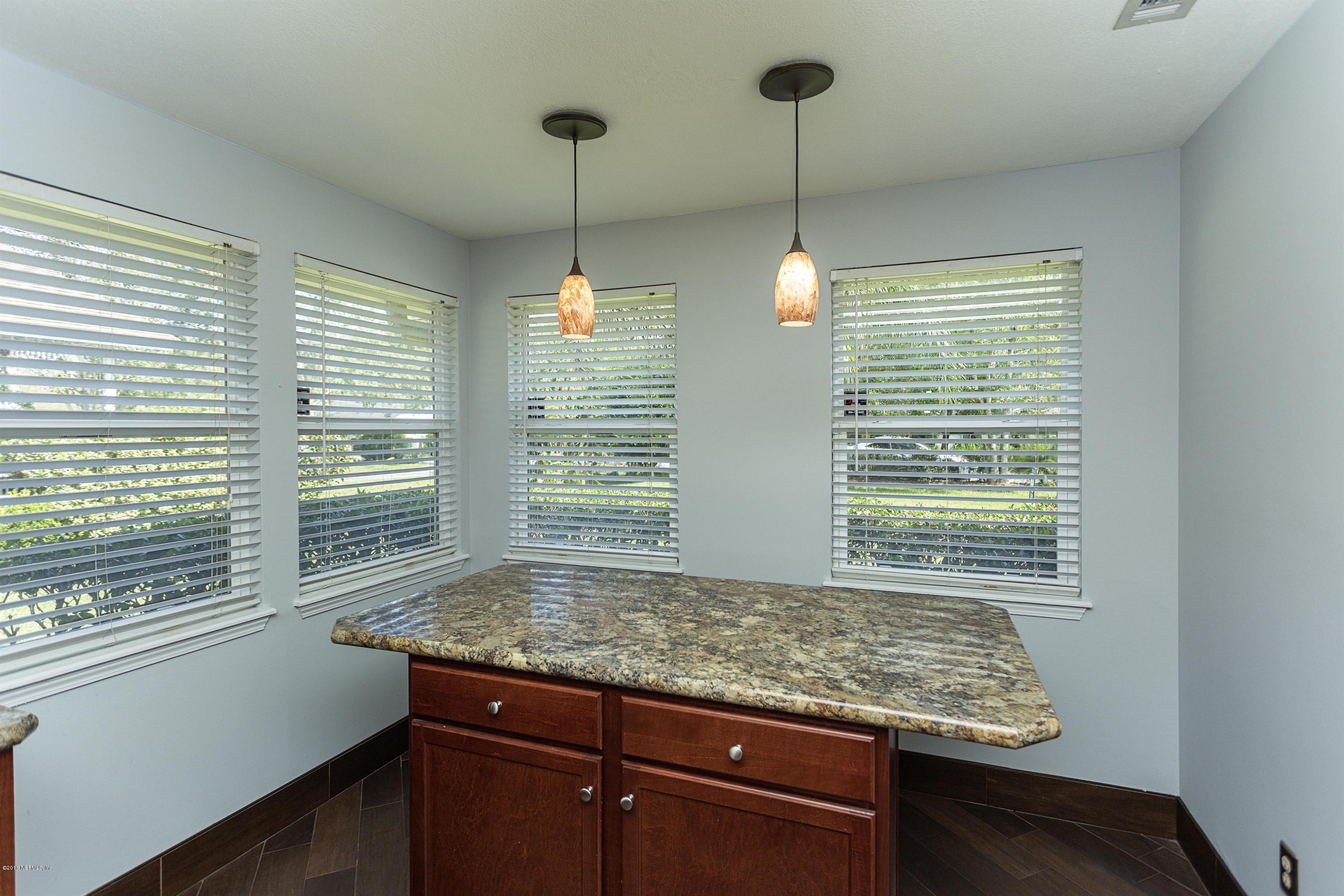 12782 Attrill Road Jacksonville, FL 32258 - Photo 12 of 25 a view of kitchen with granite countertop cabinets and window