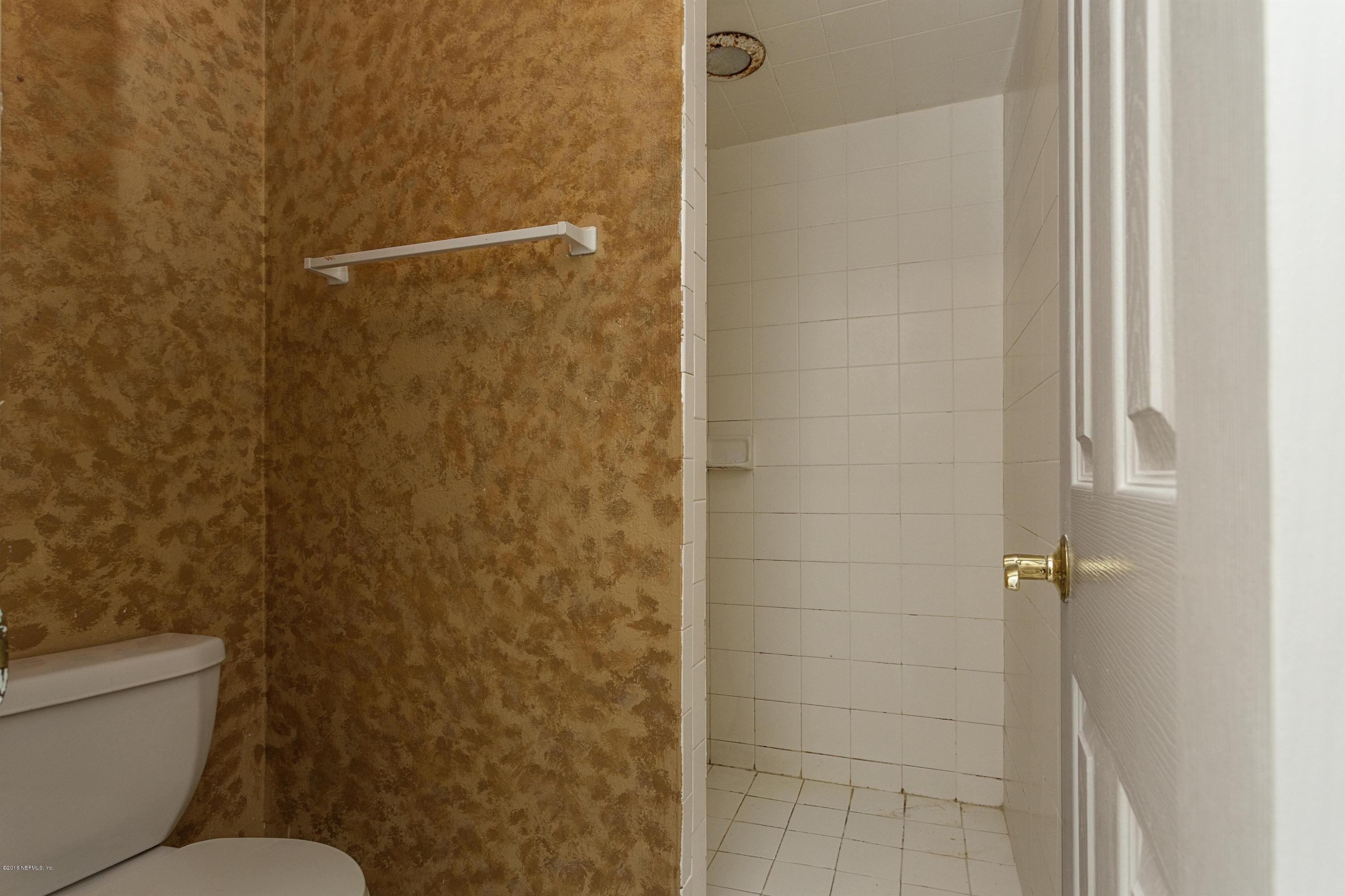 12782 Attrill Road Jacksonville, FL 32258 - Photo 16 of 25 a bathroom with a toilet and a shower