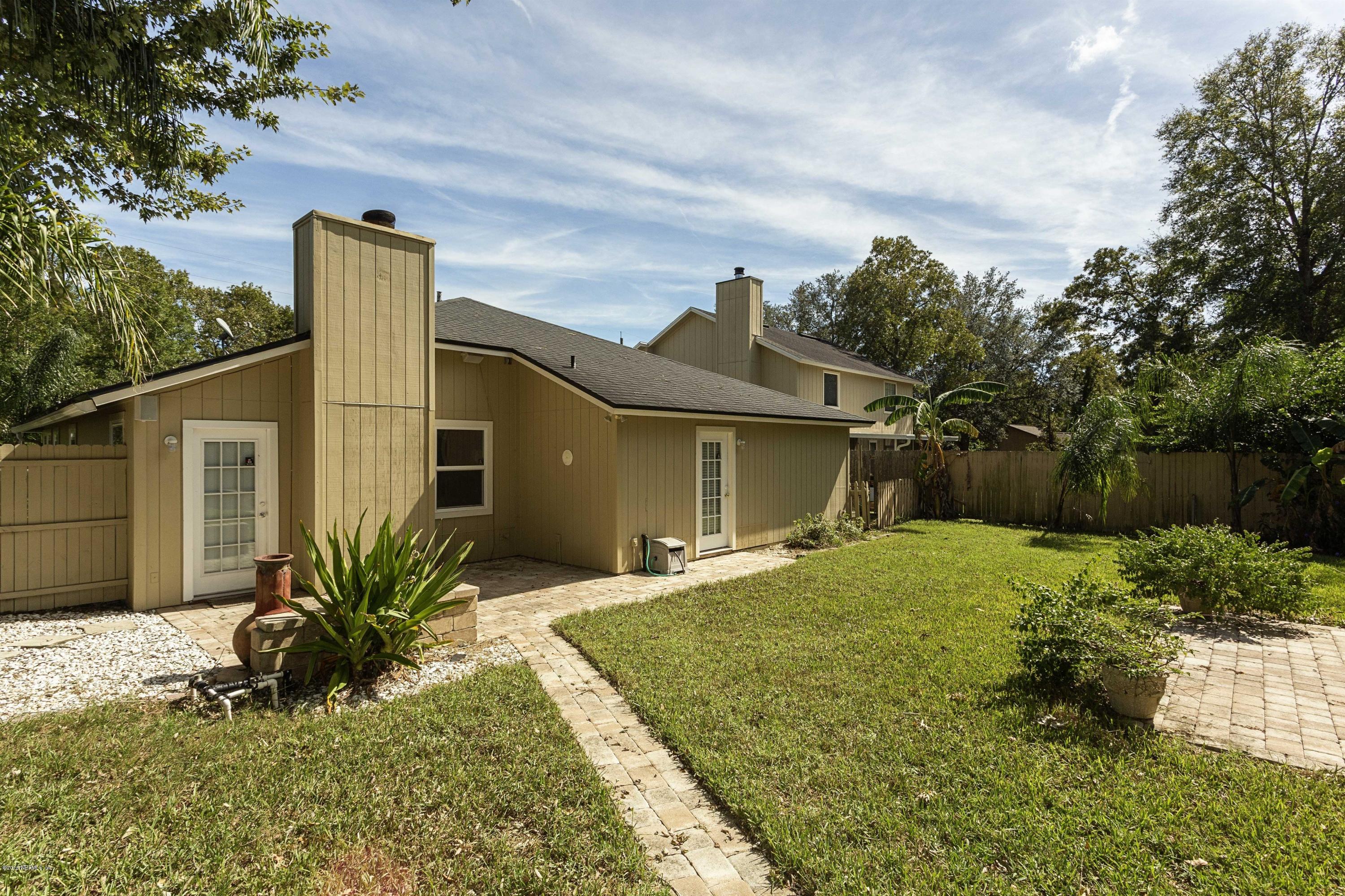 12782 Attrill Road Jacksonville, FL 32258 - Photo 23 of 25 a front view of house with yard and trees around