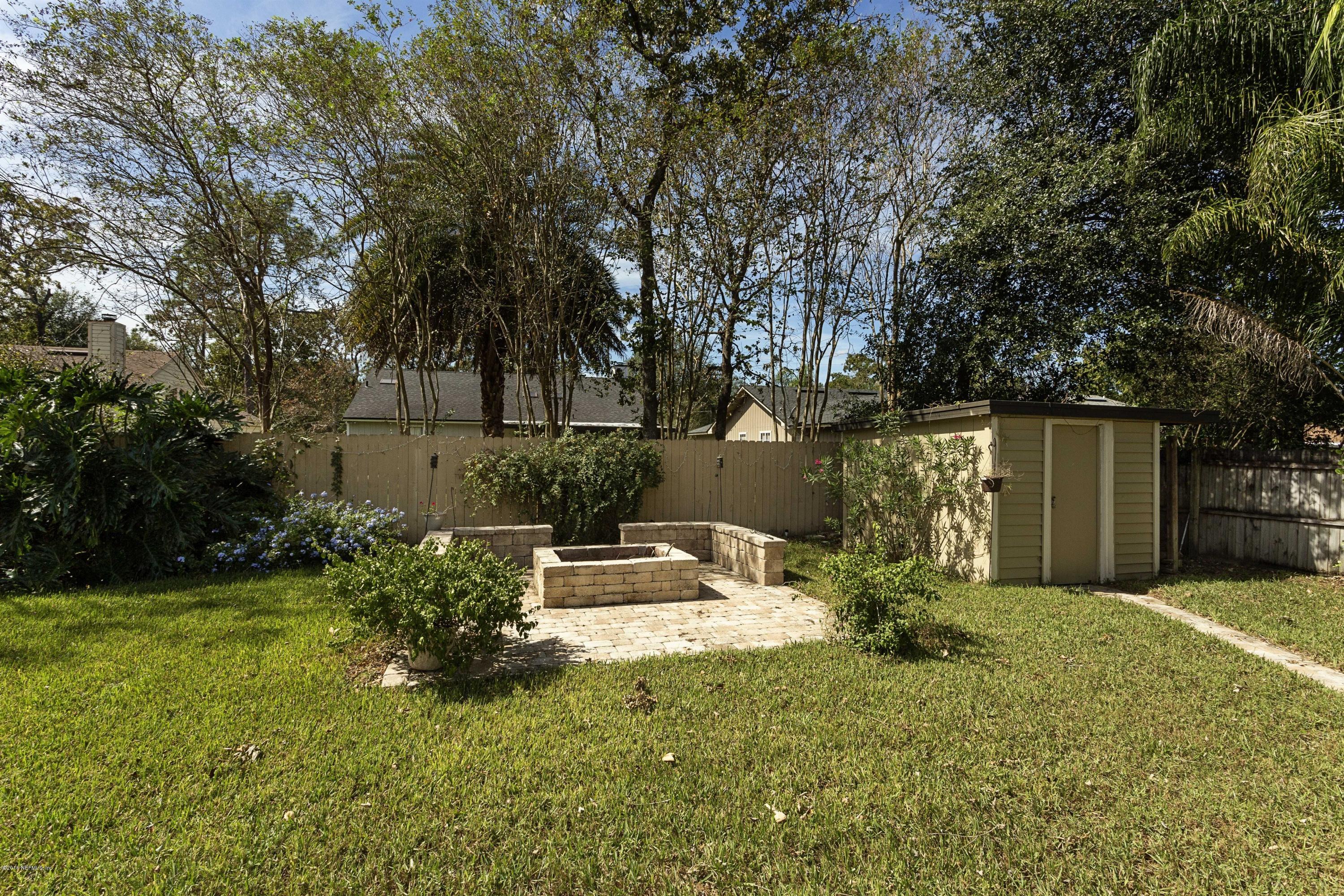 12782 Attrill Road Jacksonville, FL 32258 - Photo 25 of 25 a backyard of a house with yard and trampoline
