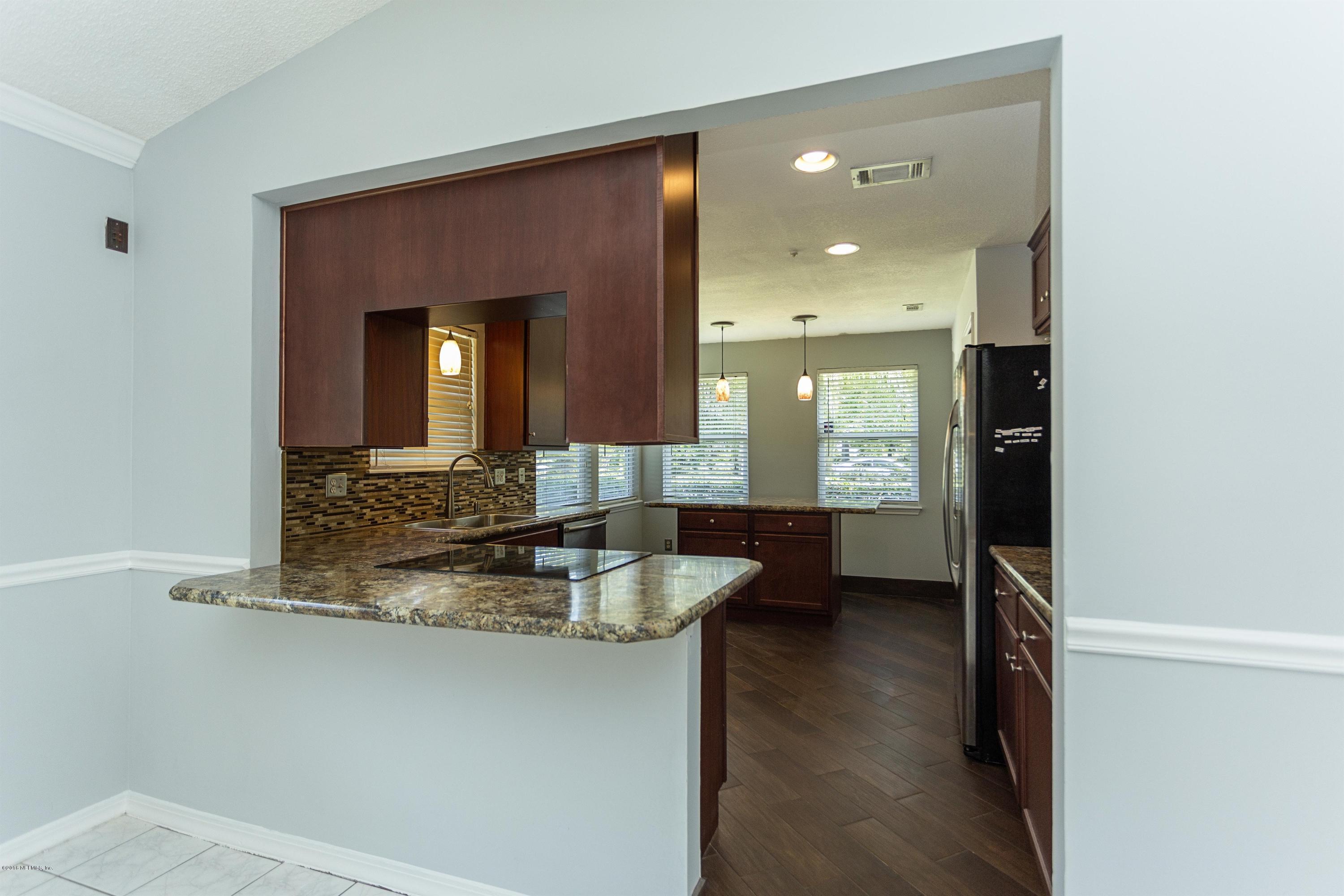 12782 Attrill Road Jacksonville, FL 32258 - Photo 7 of 25 a bathroom with a granite countertop sink a mirror and shower