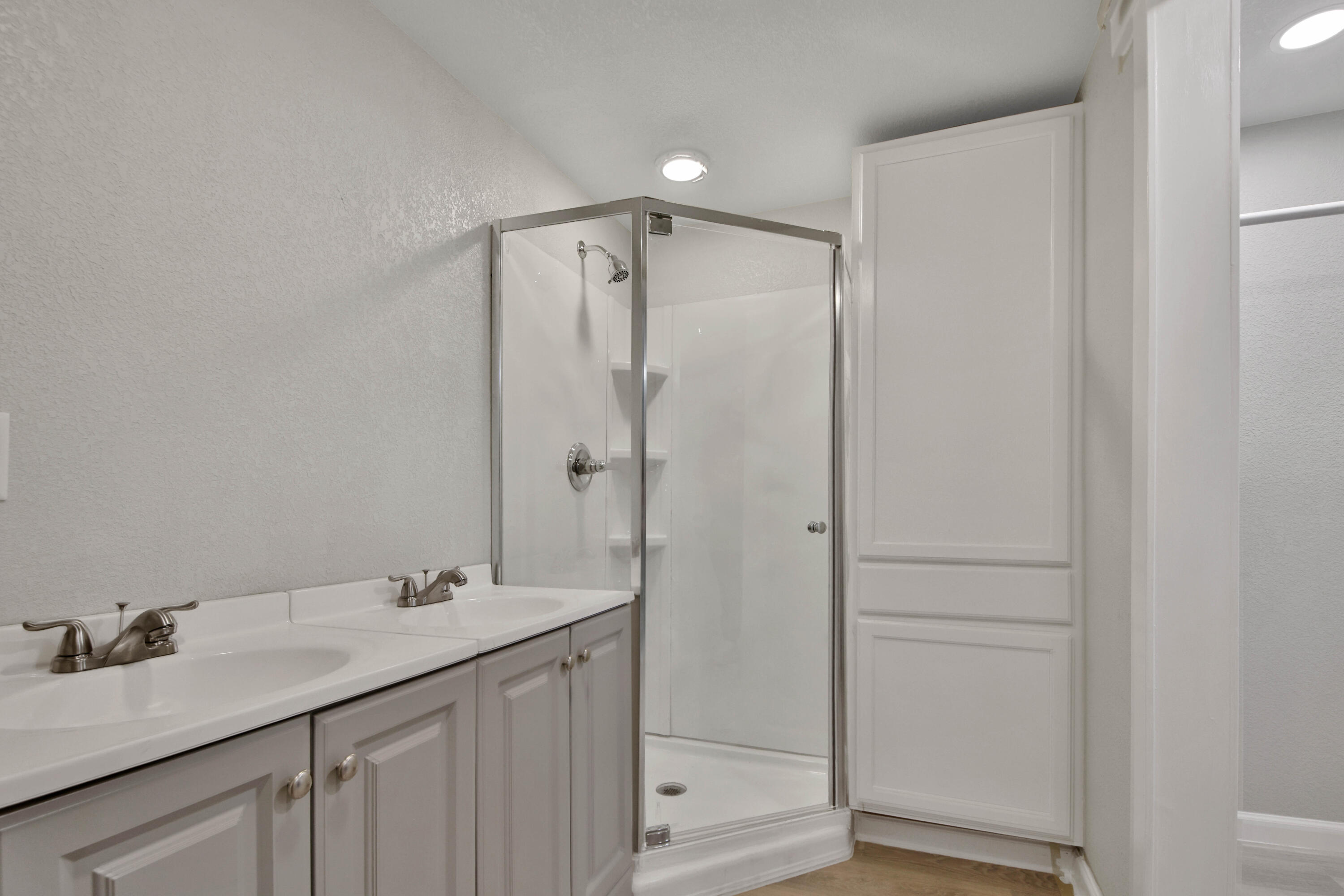 312 North Avenue R Lubbock, TX 79415 - Photo 24 of 26 a bathroom with a double vanity sink and mirror