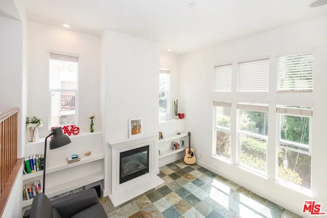 a very nice looking bedroom with a large window