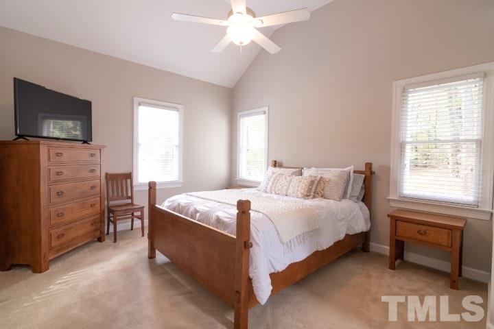 6940 Spring Drive Raleigh, NC 27613 - Photo 11 of 18 a spacious bedroom with a bed and a window