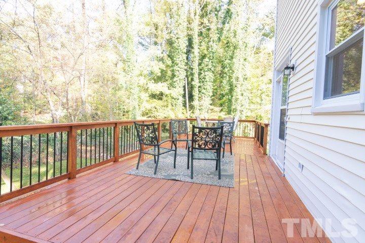 6940 Spring Drive Raleigh, NC 27613 - Photo 18 of 18 a view of balcony with wooden floor and seating space