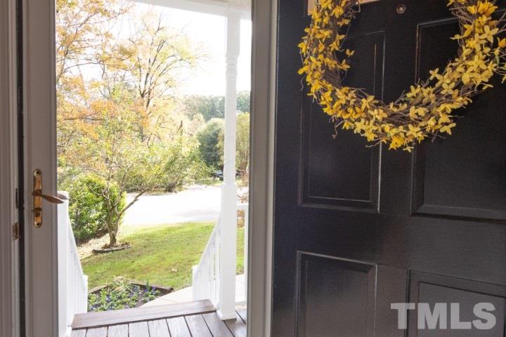 6940 Spring Drive Raleigh, NC 27613 - Photo 4 of 18 a vase of flowers sitting in a window