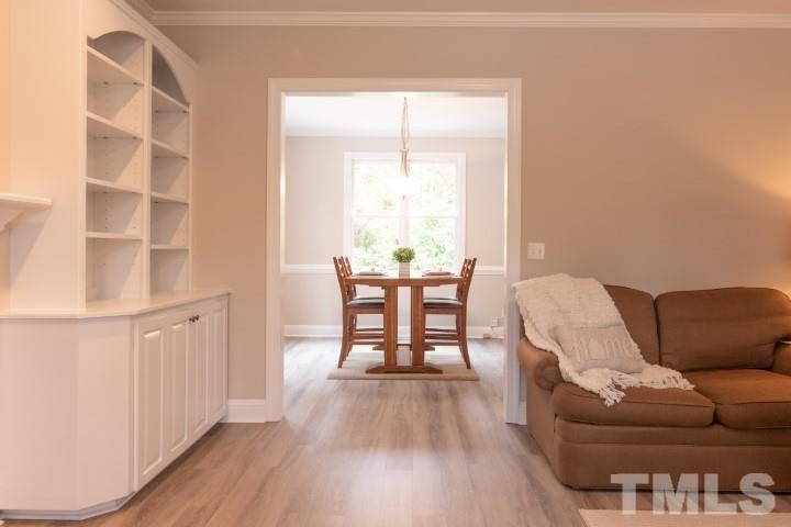 6940 Spring Drive Raleigh, NC 27613 - Photo 5 of 18 a view of a livingroom with furniture and wooden floor