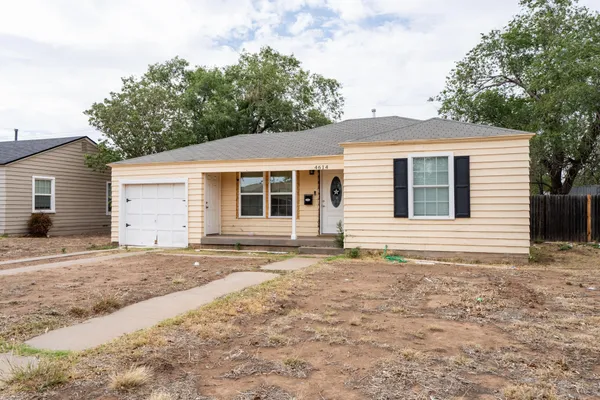 a house with trees in the background