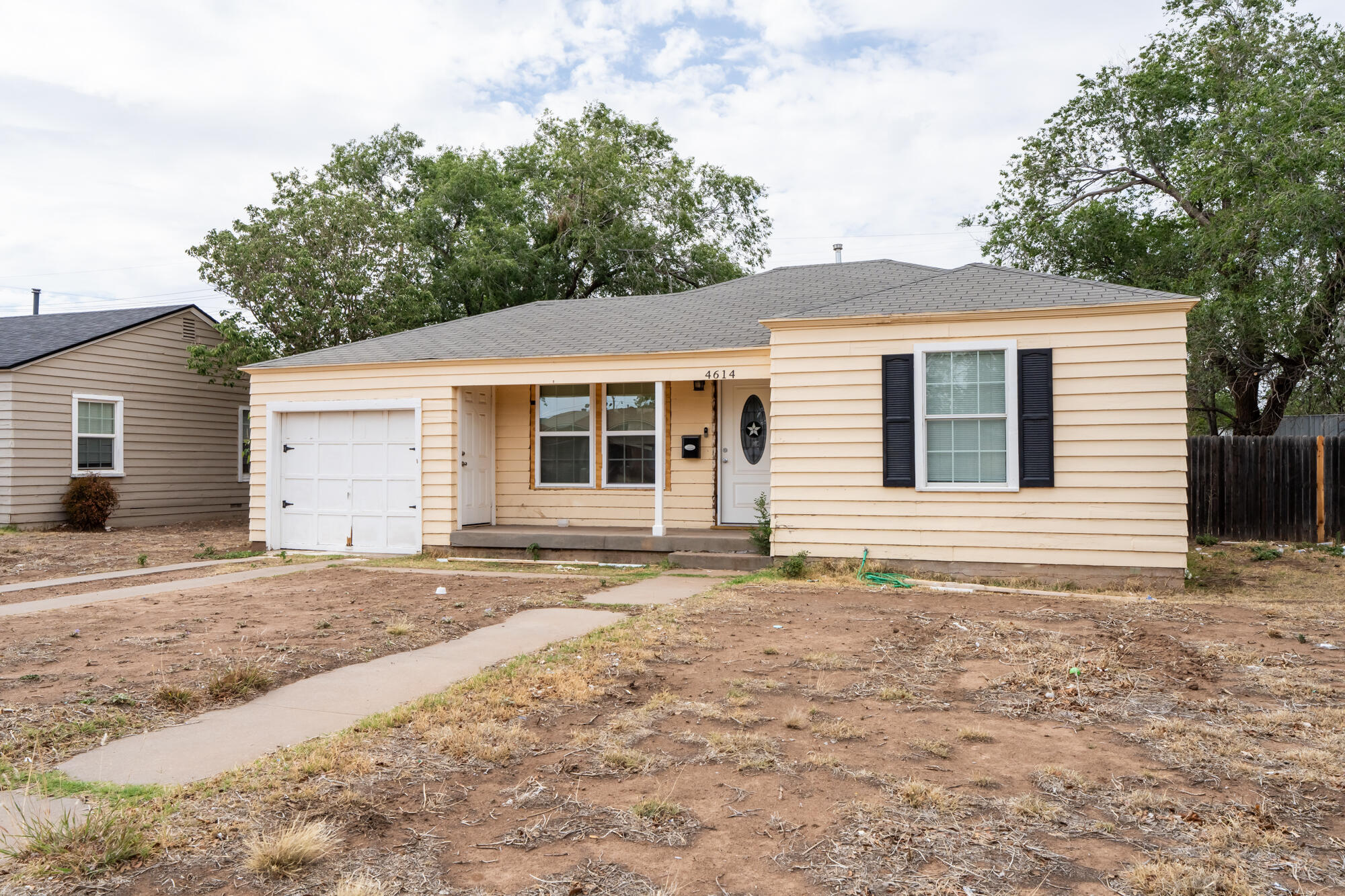 4614 33rd Street Lubbock, TX 79410 - Photo 1 of 3 a house with trees in the background