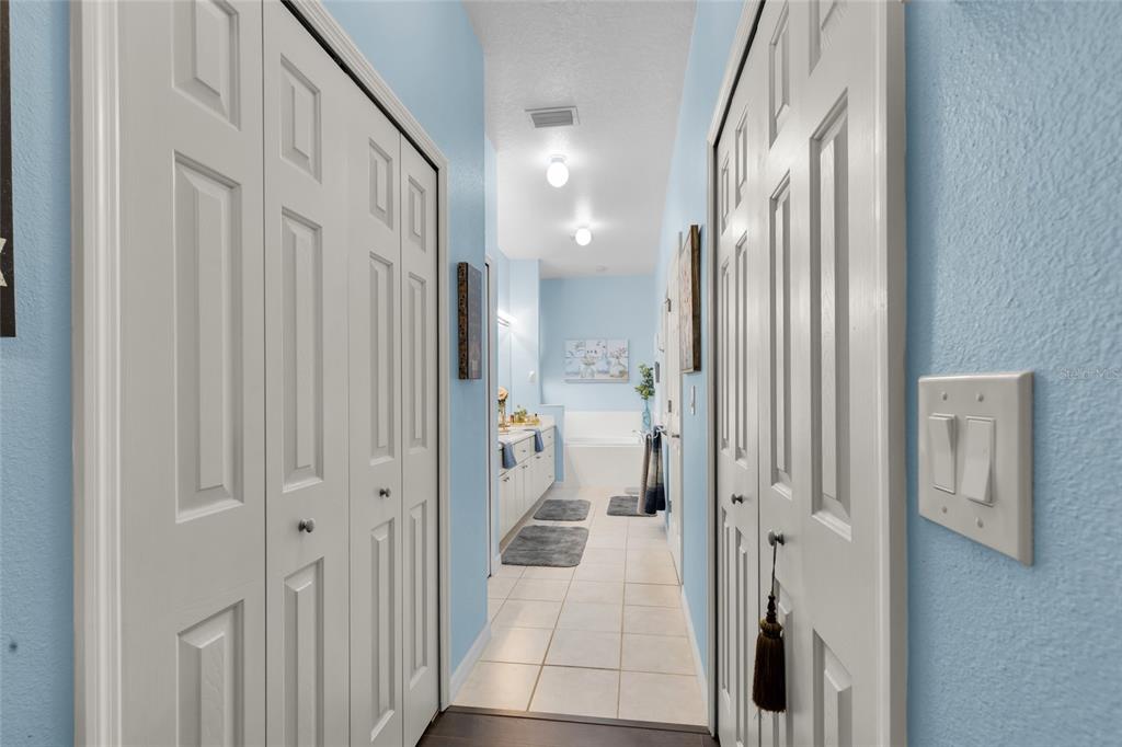 5138 Indian Ocean Loop Tavares, FL 32778 - Photo 25 of 35 a bathroom with a glass door shower