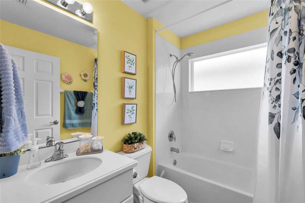 5138 Indian Ocean Loop Tavares, FL 32778 - Photo 29 of 35 a bathroom with a sink toilet and shower