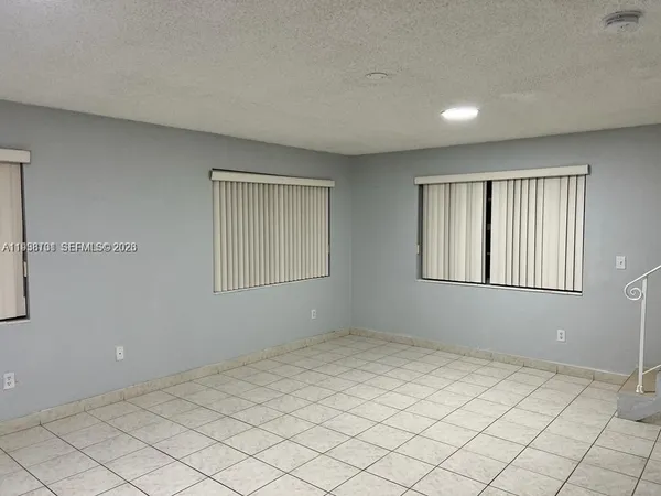 a view of an empty room with window