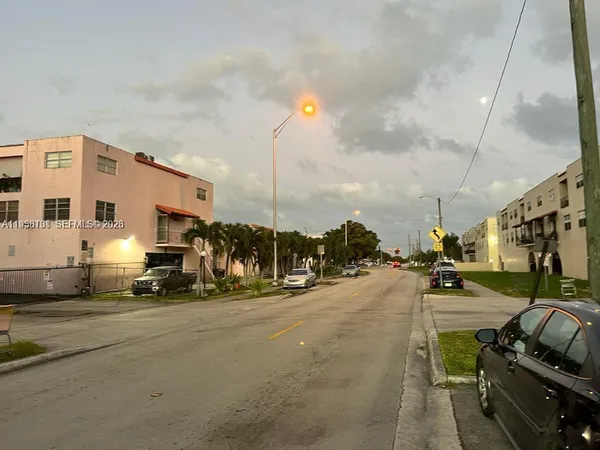 a view of a street with cars