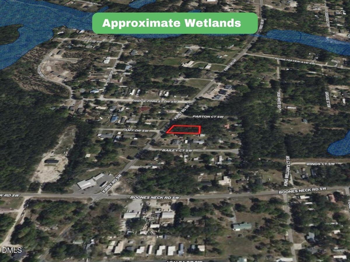 2310 Kirby Road Southwest Supply, NC 28462 - Photo 7 of 21 a sign that is sitting in a backyard