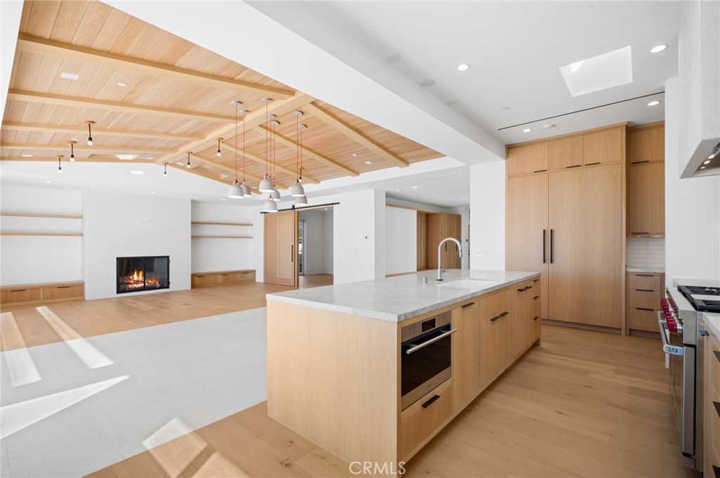 4607 Dorchester Road Corona del Mar, CA 92625 - Photo 12 of 34 a large white kitchen with a stove a sink and dishwasher