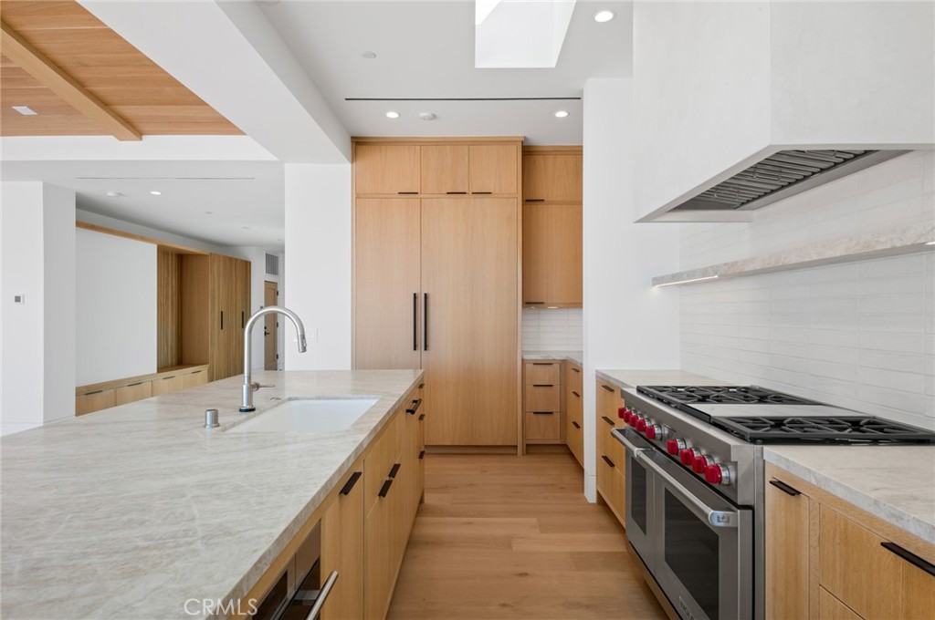 4607 Dorchester Road Corona del Mar, CA 92625 - Photo 13 of 34 a kitchen that has a sink and a stove