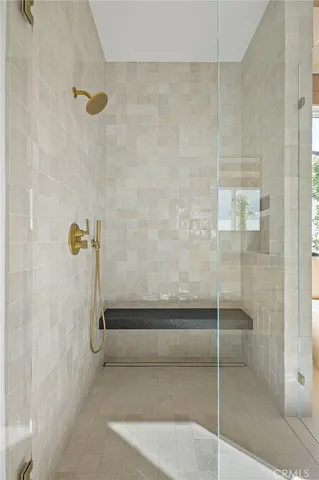 a bathroom with sinks mirror and cabinets