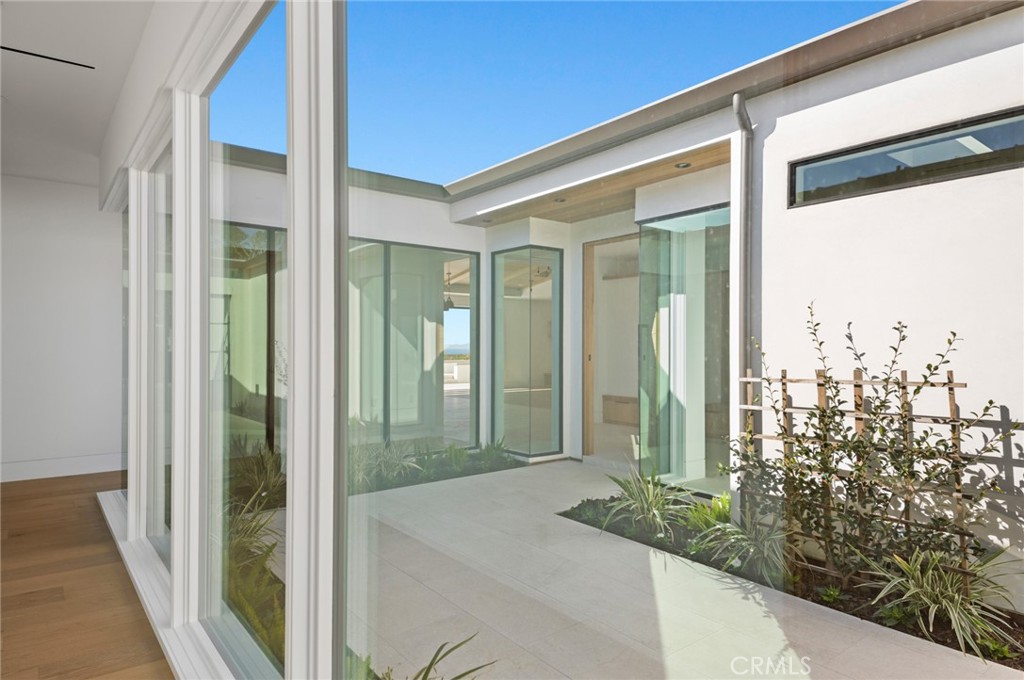 4607 Dorchester Road Corona del Mar, CA 92625 - Photo 2 of 34 a front view of a house with a garden