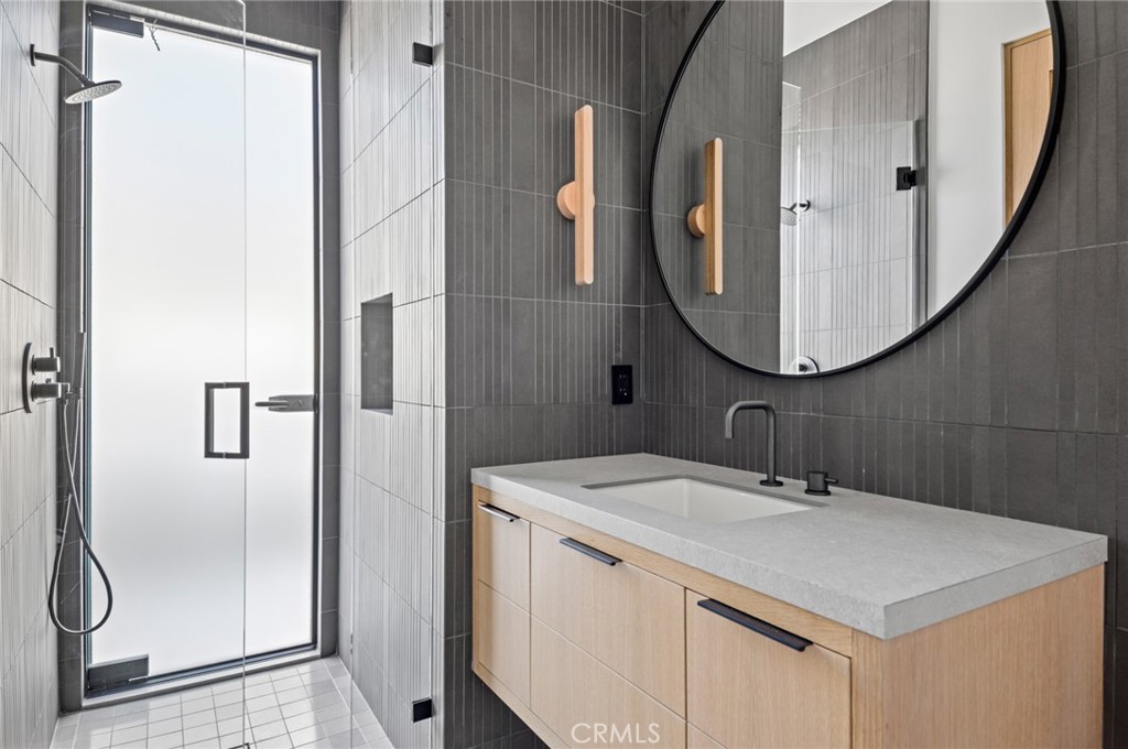 4607 Dorchester Road Corona del Mar, CA 92625 - Photo 24 of 34 a bathroom with a sink and a mirror