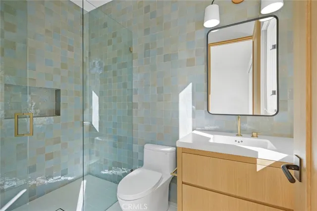 a lobby with a couch and a potted plant