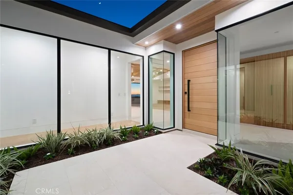 a large white kitchen with a large window