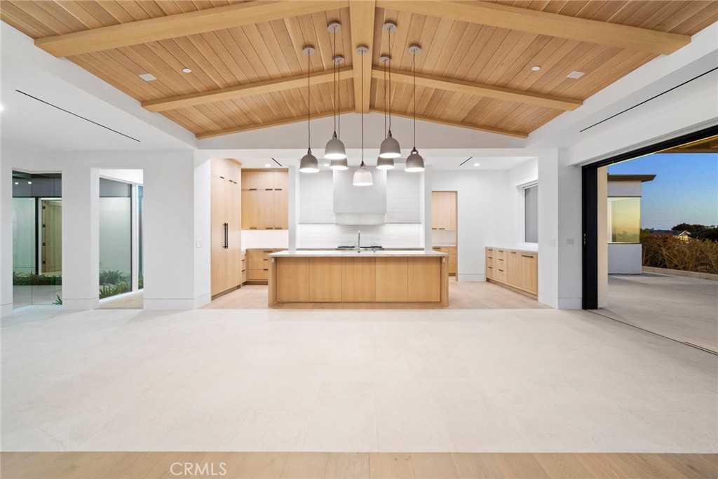4607 Dorchester Road Corona del Mar, CA 92625 - Photo 30 of 34 a large white kitchen with a large window