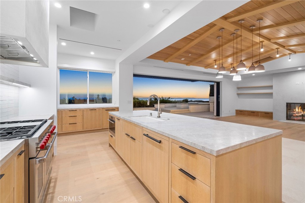 4607 Dorchester Road Corona del Mar, CA 92625 - Photo 32 of 34 a kitchen with stainless steel appliances a sink and stove