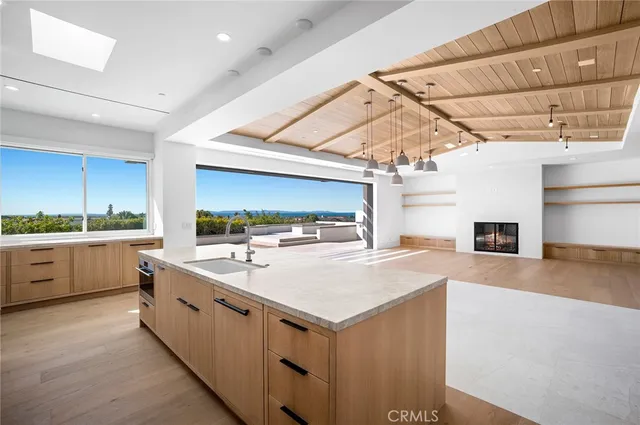 a kitchen with a sink and a stove top oven